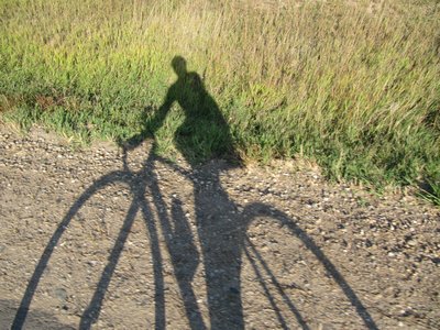 Sandy and Scooter casting a long, fall shadow